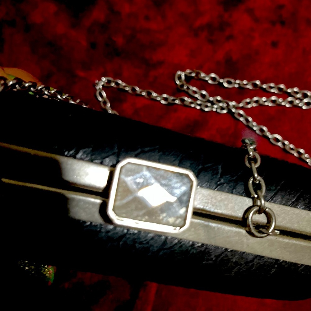 Black snap up clutch with chain hand bag